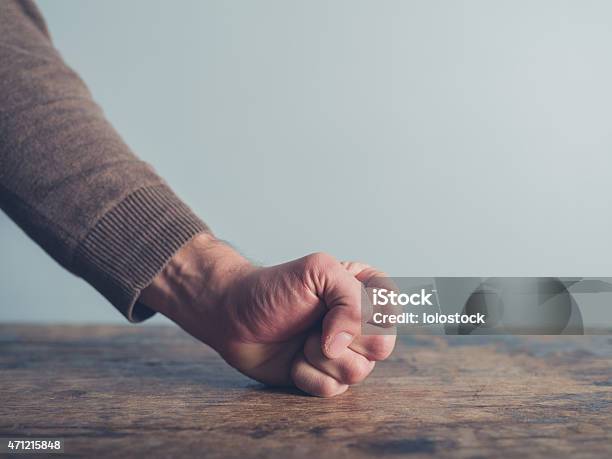 Man Slamming His Fist On Table Stock Photo - Download Image Now - Table, Fist, Hitting