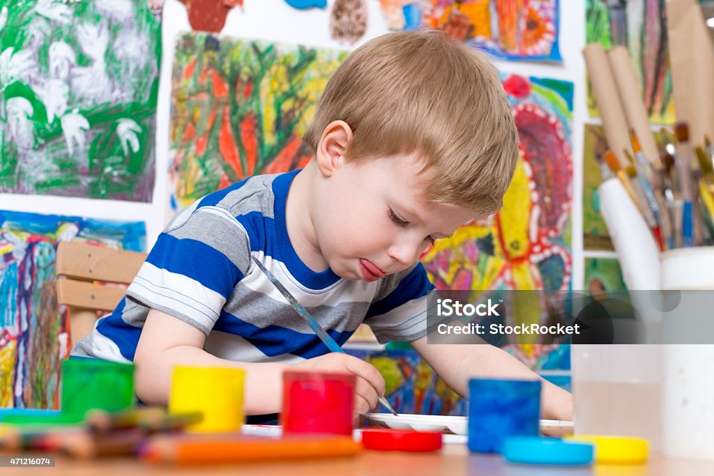 Little Boy Painting Toddler boy deals with art 2015 Stock Photo