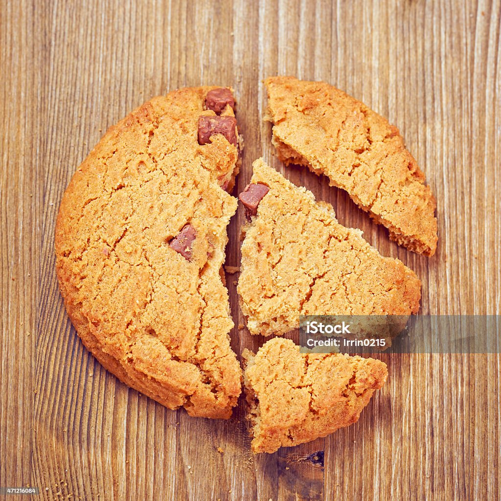 Chocolate cookies Break chocolate chip cookies on a wooden table 2015 Stock Photo