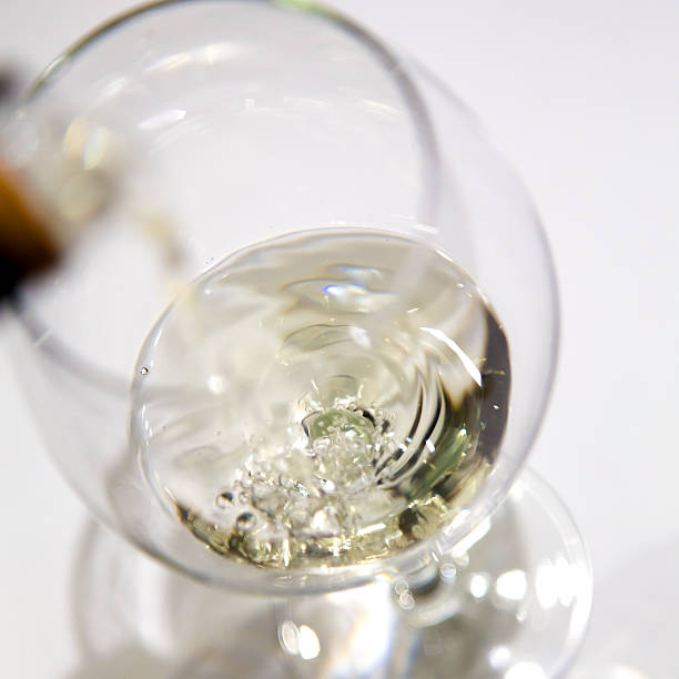 istock Filling a wineglass with white wine 471216382