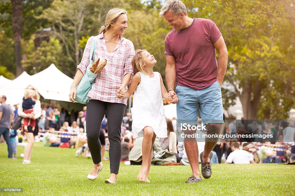 Family Relaxing At Outdoor Summer Event Agricultural Fair Stock Photo