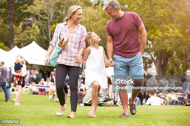Family Relaxing At Outdoor Summer Event Stock Photo - Download Image Now - Agricultural Fair, Family, Farmer's Market