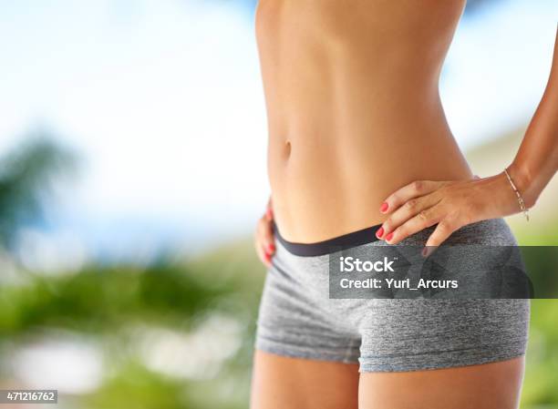 Flaunting Her Fab Abs Stock Photo - Download Image Now - Flat - Physical Description, Women, The Human Body