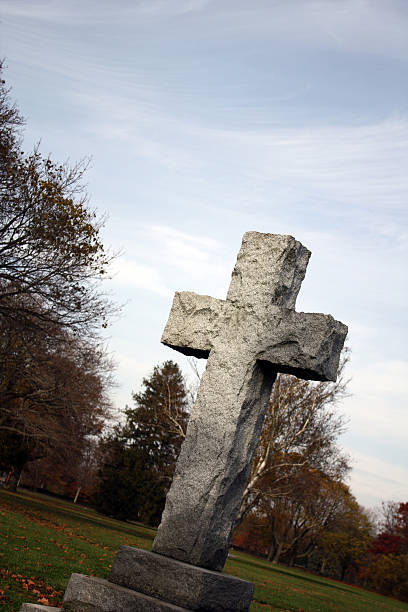 istock Cross Against a Pale Blue Sky 471217597