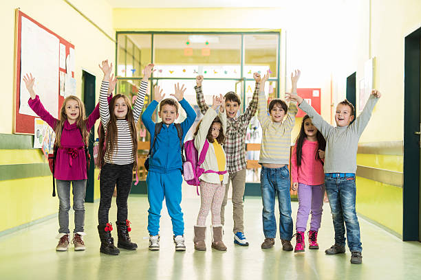 istock Large group of elementary students in the school hallway. 471218280