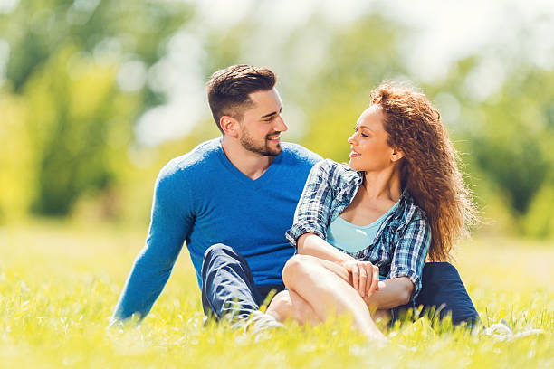 istock Happy couple enjoying a day in the park and communicating. 471218520