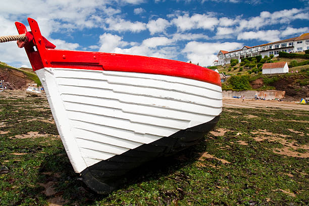 fishing boat berth at low tide stock photo