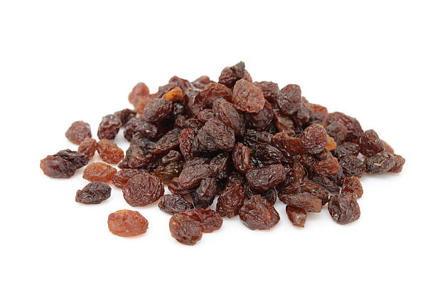 Raisins Raisins isolated on a white background raisin stock pictures, royalty-free photos & images