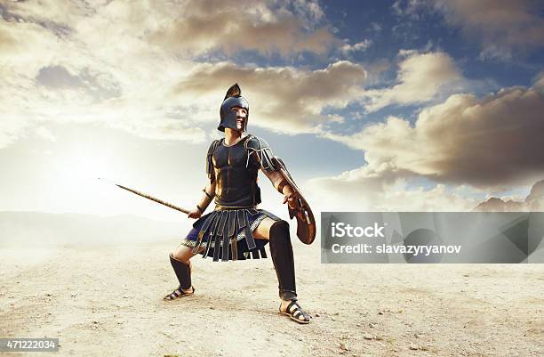 Ancient Warrior In A Typical Black Costume Holding A Spear Stock Photo - Download Image Now