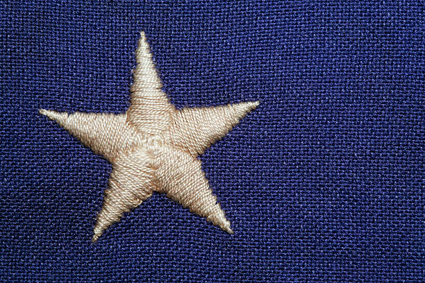 Drapeau d'une étoile brodées sur un fond bleu - Photo