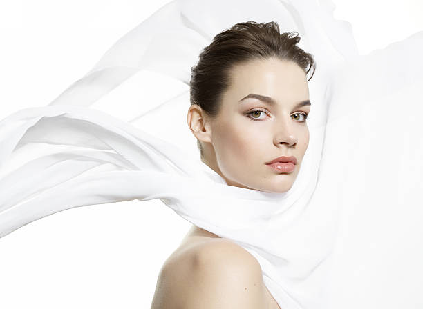 istock Beautiful woman with white cloth around face 471223373