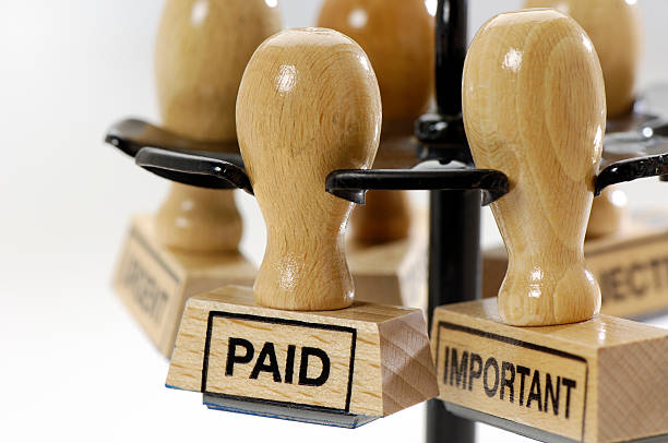 istock Rubber stamps paid and important in a desk organizer 471224519