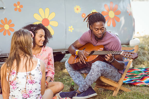 istock Hipster playing guitar for his friends 471225578