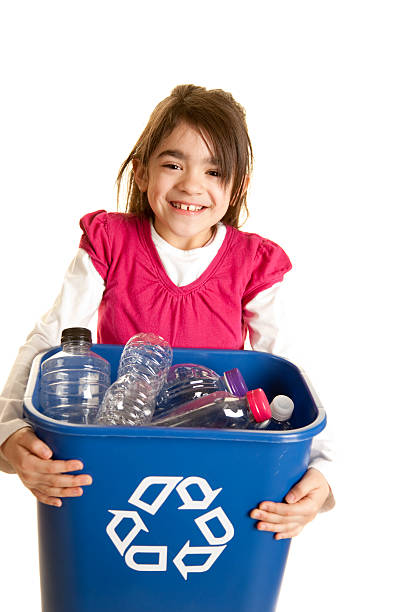 istock Go Green: Hispanic Little Girl Holding Full Recycling Bin 471228703