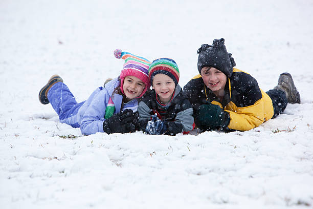 istock Three Happy Children in the Snow 471228859
