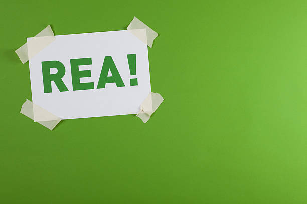 istock REA! sign taped on green background 471229737