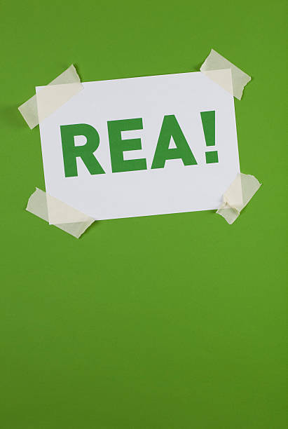 REA! sign taped on green background
