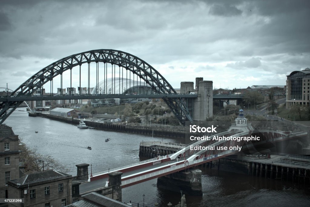 Newcastle Tyne bridges Newcastle-upon-Tyne, United Kingdom - October 26, 2014: View of the Tyne bridges between Newcastle and Gateshead viewed from the High Level Bridge at the Newcastle end of the bridge.  The swing bridge is the Port of Tyne bridge in the foreground, it swivels about a central pivot to allow larger vessels to pass either side of the pontoons. Tthe Tyne bridge is in the background. 2015 Stock Photo