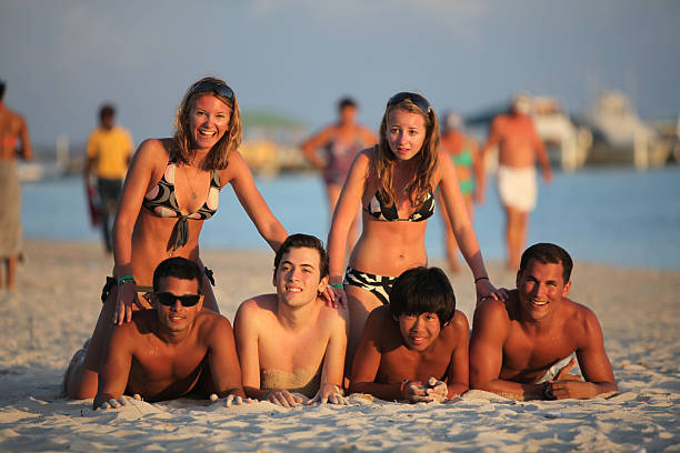 istock Friends hanging out on beach 471231705