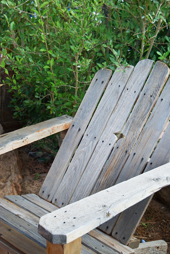 Adirondack Chair, Handmade Antique, Weathered Gray with Green Folage in Background