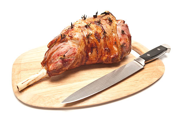 Roasted leg of lamb on a white background