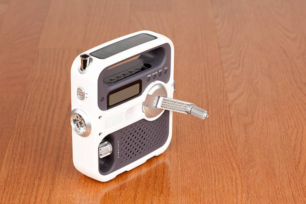 Emergency Radio Emergency radio with built in flashlight and solar cell or hand crank for power. crank mechanism photos stock pictures, royalty-free photos & images