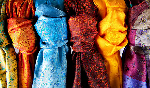 A collection of colorful Indian saris colors of  indian silk india indian culture market clothing stock pictures, royalty-free photos & images