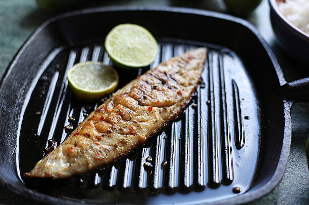 freshly caught sardines on the charcoal grill