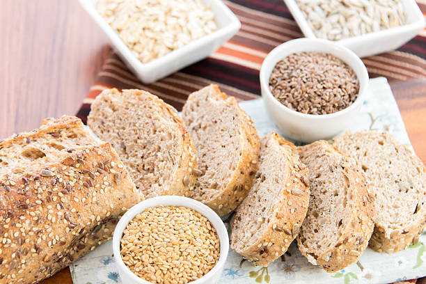 a fresh baked loaf of whole grains bread with poppy, flax adn sunflower seeds