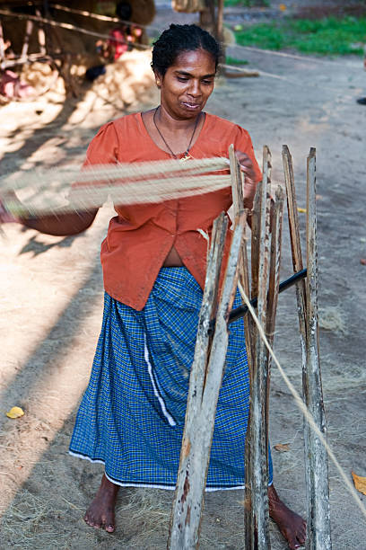 istock Women weaving a rope 471235553