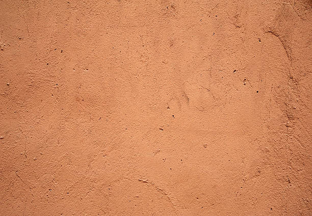 istock Texture of old wall covered with pink stucco 471236460