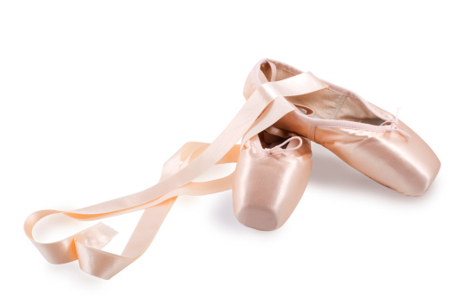 New pointe ballet shoes, ribbon creating a heart- symbolysies the girl's love to all concerning ballet and romantic, isolated on white with clipping path.