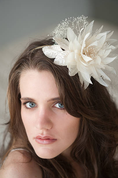 headshot of woman with bridal hairpiece stock photo