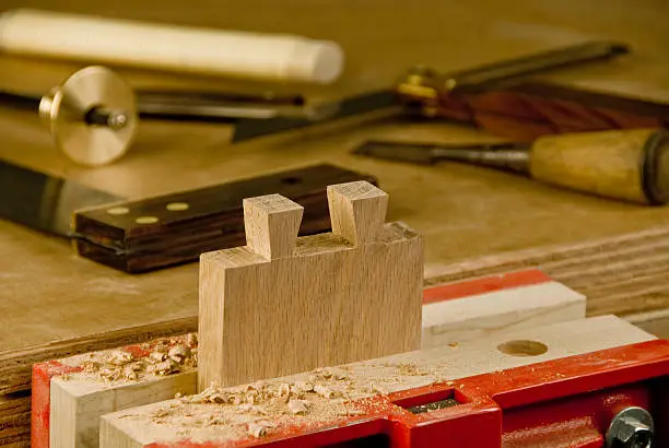 Dovetails being cut into the end of a board