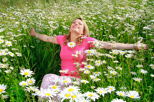 Happy woman in flower field