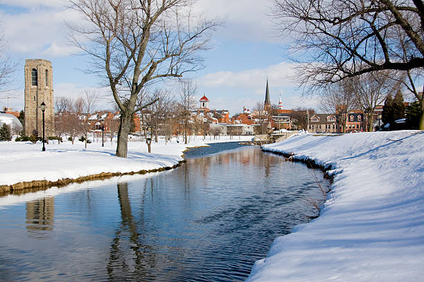 Snow Covered Park and Flowing Stream stock photo