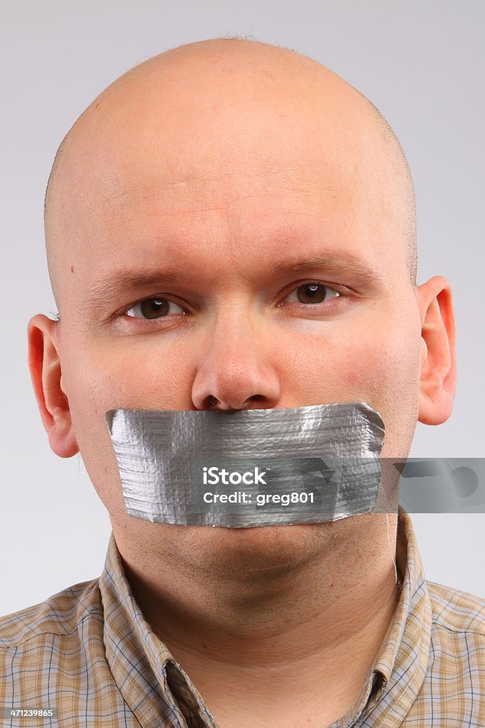 Bald man with the grey tape taped up on mouth Adhesive Tape Stock Photo