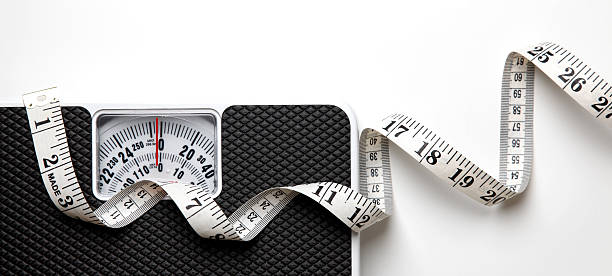 Scales and tape measure stock photo