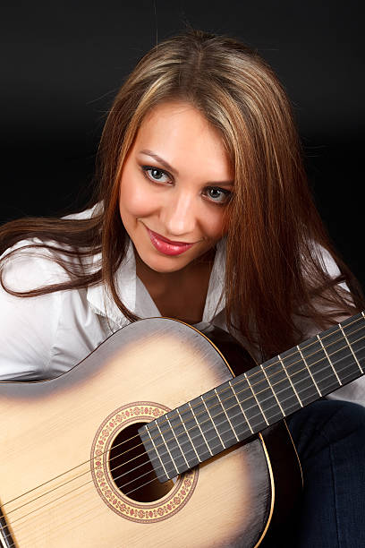 istock Woman with guitar. 471240069