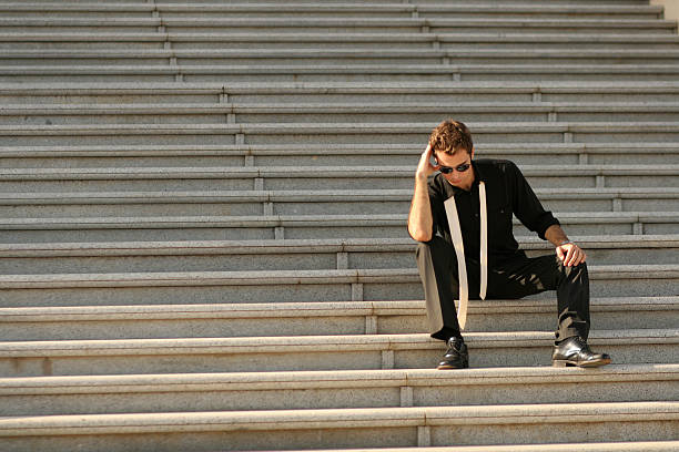 istock Stressed businessman on big stairs 471241323