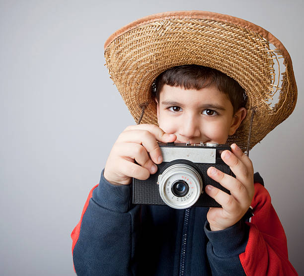 istock Little boy photographer 471242053