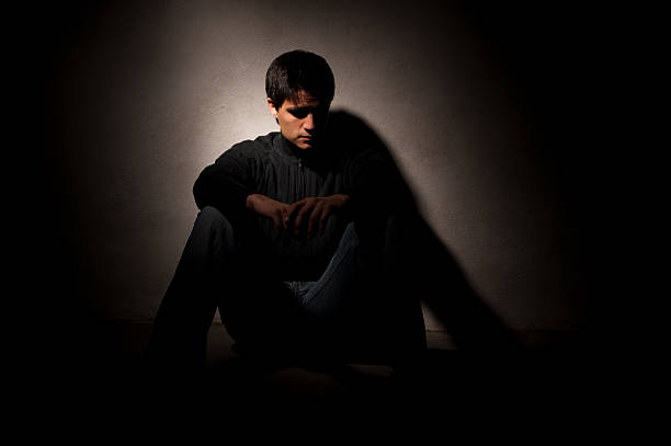 istock Man sitting in a dark room 471242777