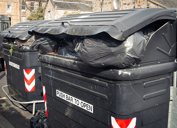 istock Overflowing, dirty communal street bins 471243204