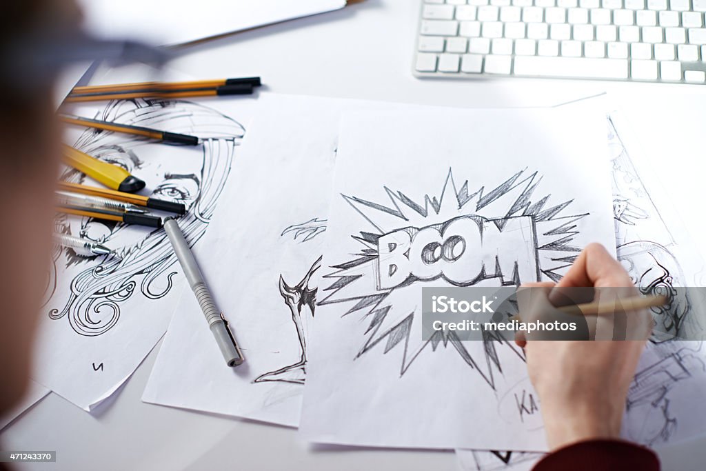 Boom! Artist drawing picture with word: "Boom!" Comic Book Stock Photo