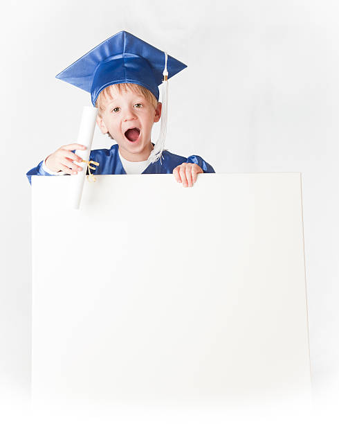 istock Happy Little Graduate Holding a Sign 471243409