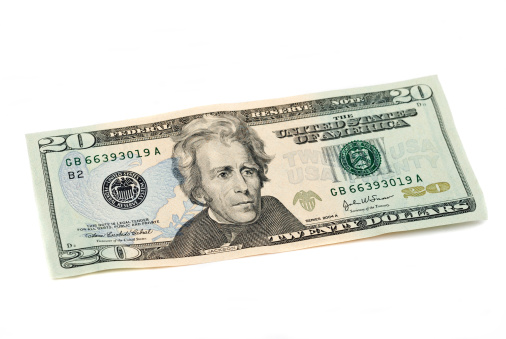 Twenty dollar bill, United States Currency, on white. Studio shot. 