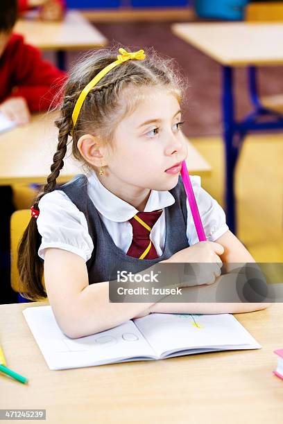 Pensive School Girl Daydreaming Stock Photo - Download Image Now - 6-7 Years, Blond Hair, Blouse