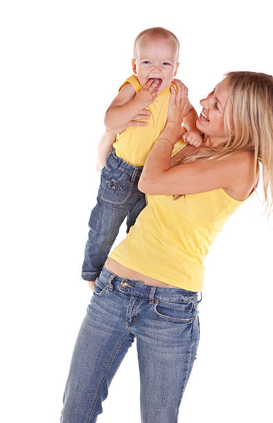 istock Mother with her baby smiling and having fun 471245523