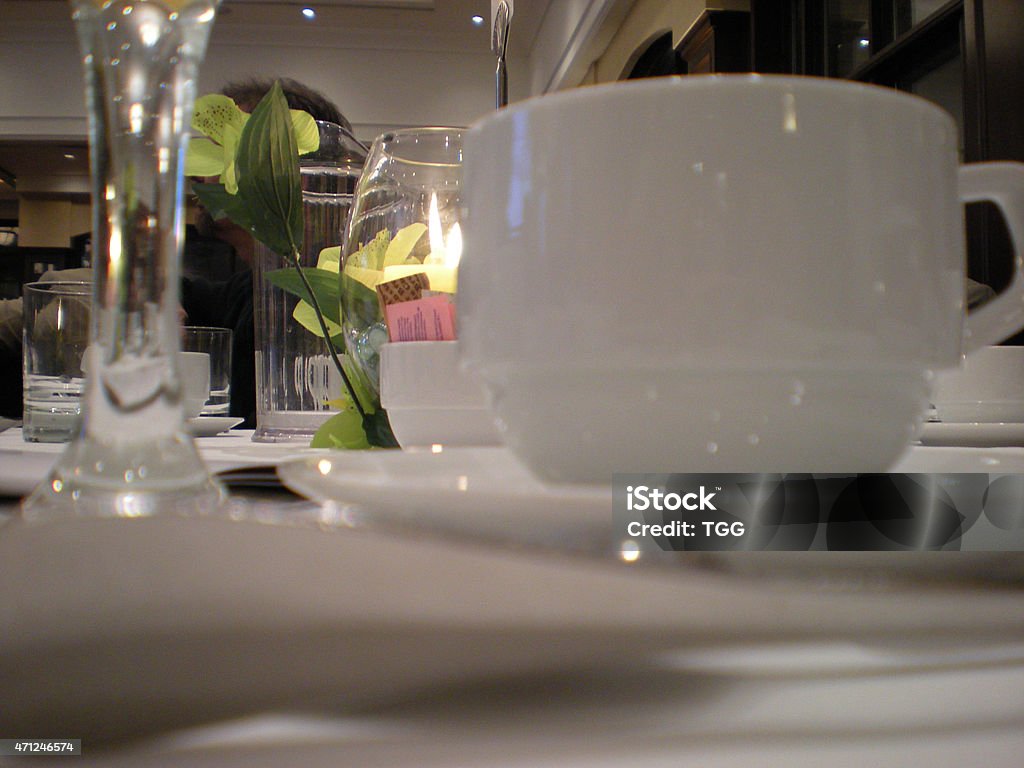 Formal Dinner Setting with Coffee Cup in White Photo was taken at a business meeting in Ontario, Canada, in 2000 with a Canon camera.  2015 Stock Photo