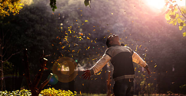 Man stretches out his arms and feels the breeze